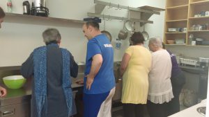 Volunteers and participants in the programs community kitchen