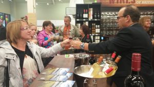 A Save-on-Foods employ serves up a wine taster at the Spruceland store