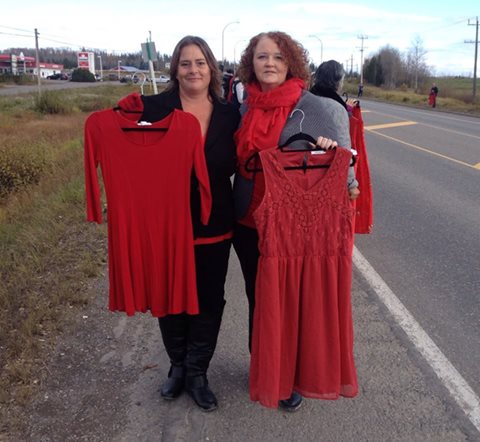 Tammy (left) holding up her dress for Kari Ann Gordon