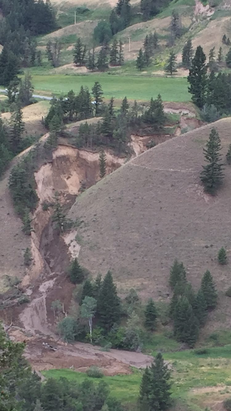Highway 20 washed out, one car pulled from river