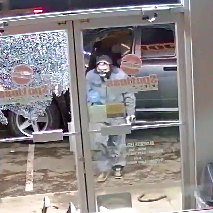 Pair of thieves make off with ATM on busy street
