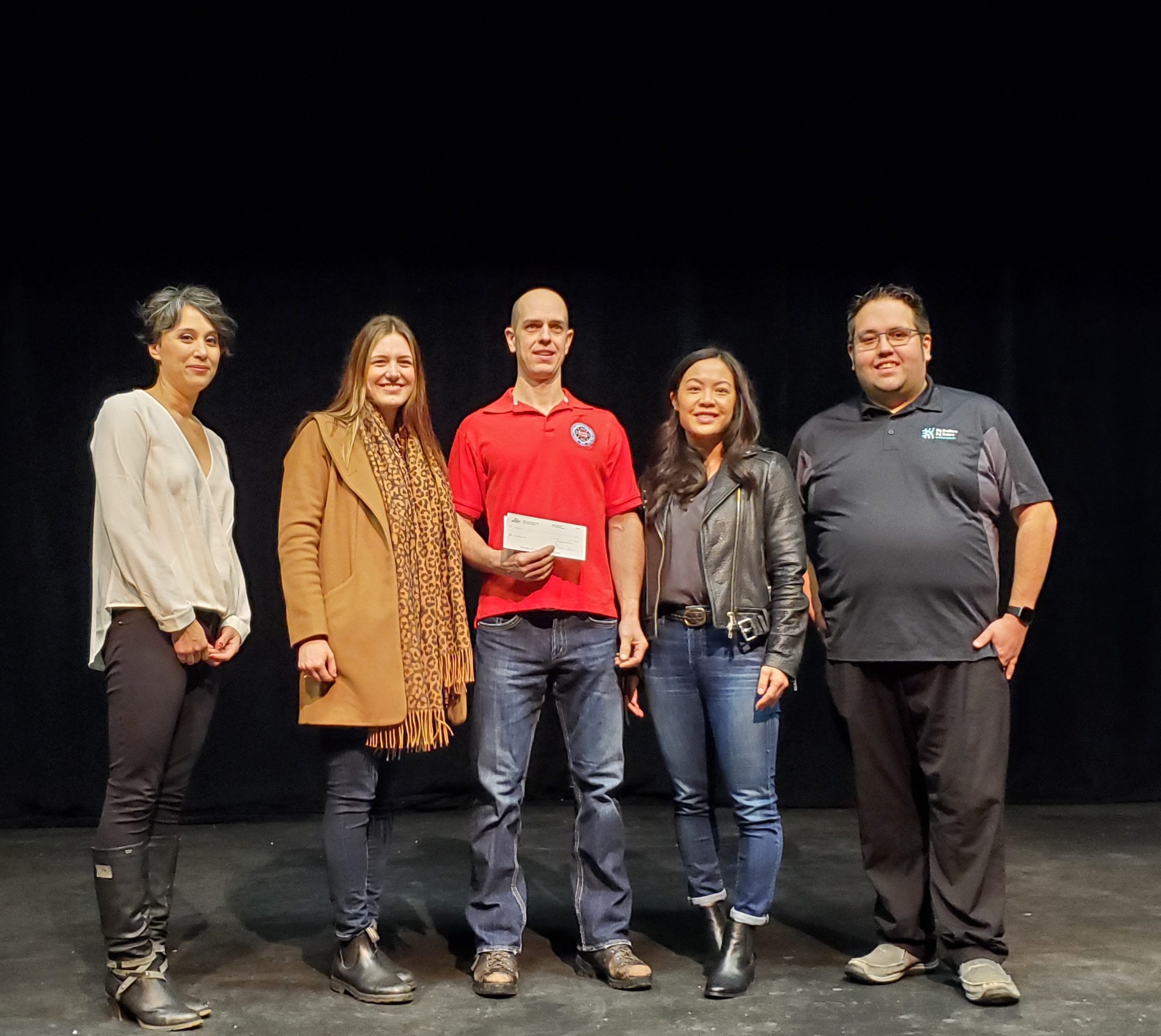 Bryan Burleigh accepting money on behalf of the BC Burn Fund