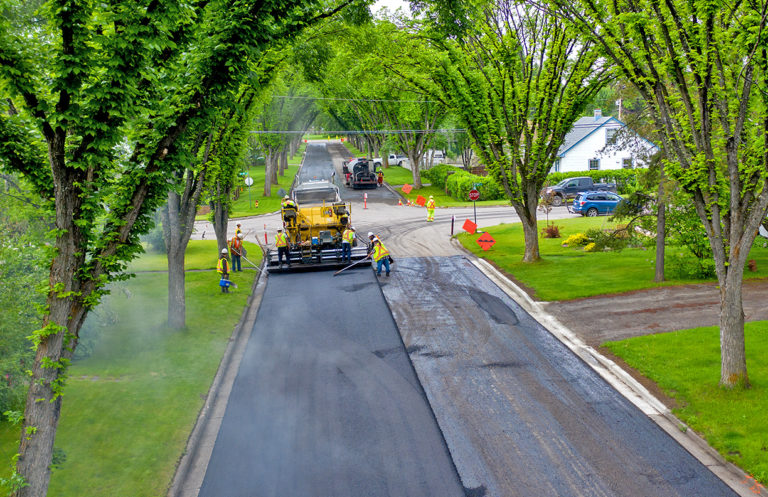 Despite rain delays, nighttime paving operations still underway in Prince George