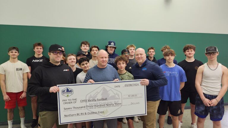 Northern RV Expo organizers make $7,300 donation to high school football team
