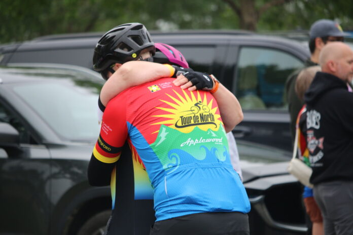 Two Cops for Cancer Tour de North Riders share an emotional moment before their training ride to honour team member Shane Kelly (D. Bain, My PG Now staff)