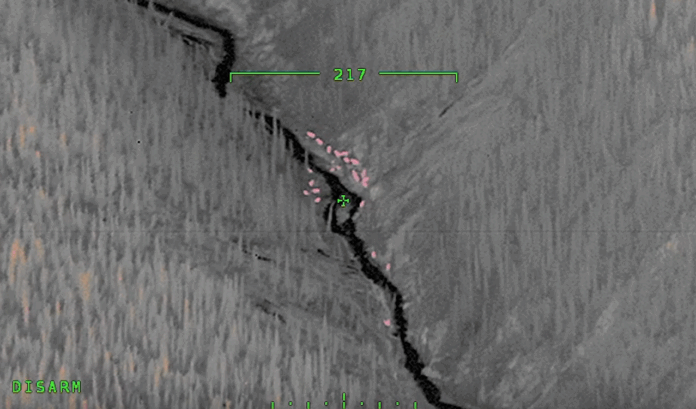 Night image from search aircraft of a group of horseback riders near Fort Nelson. Image courtesy of 19 Wing Comox